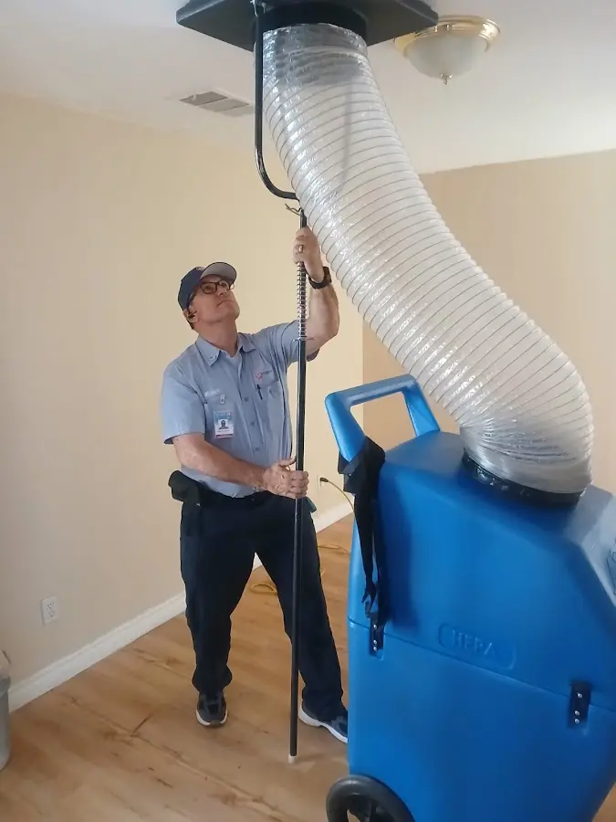 Furnace Tune-Up technician using HEPA equipment in Prior Lake